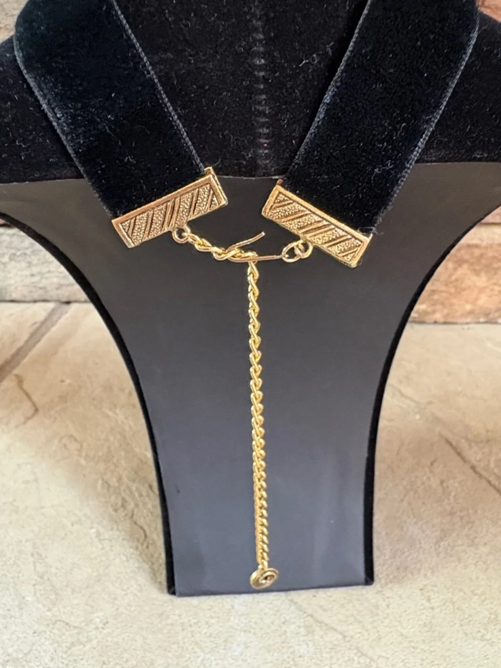 Celebrity black velvet choker with gold tone rose accent